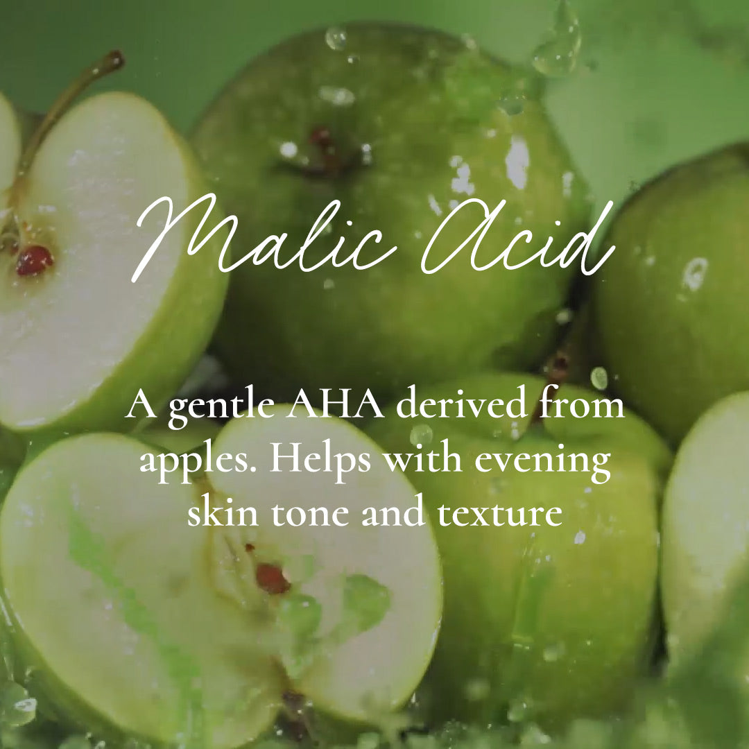 Graphic of green apples with text “Malic Acid – A gentle AHA derived from apples. Helps with evening skin tone and texture