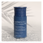 Glowbiotics Probiotic Brightening + Refining Layering Solution bottle standing upright on a textured white surface with palm leaf shadow