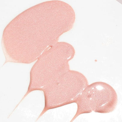 Close-up of shimmering pink serum texture on a white background