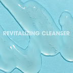 Glowbiotics Probiotic Revitalizing Cleanser gel texture on blue background with text “Revitalizing Cleanser”