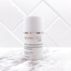 Lifestyle image of Glowbiotics Probiotic Brightening Renewal Lotion against white tile background