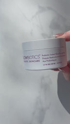 Close-up video showing Glowbiotics Probiotic Triple Action Resurfacing Pads, followed by the Probiotic Brightening + Refining Layering Solution bottle