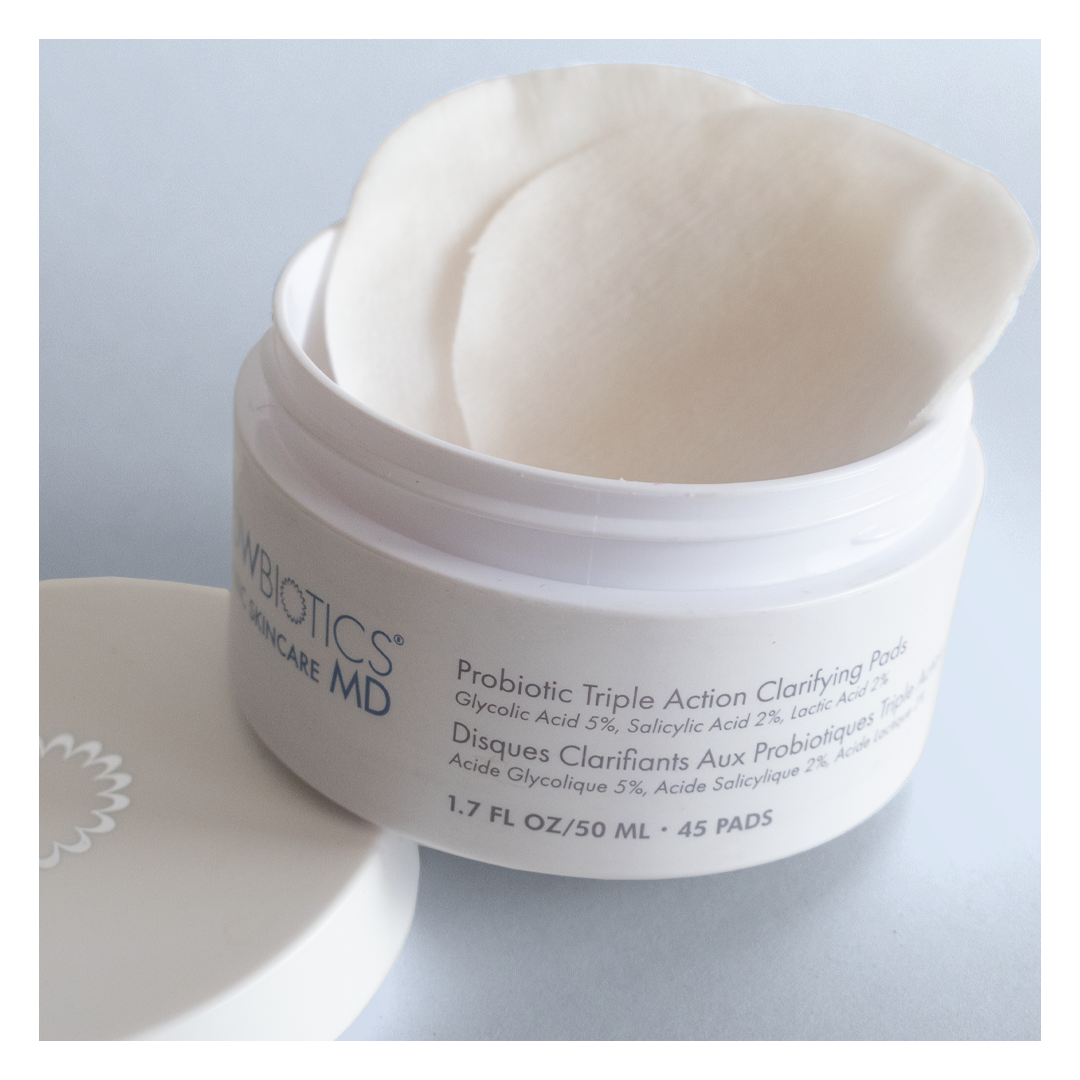 Open jar of Glowbiotics Probiotic Triple Action Clarifying Pads showing stacked pads inside