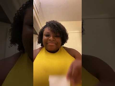 Video thumbnail – woman in yellow top holding Glowbiotics Probiotic Clarifying Cleanser.