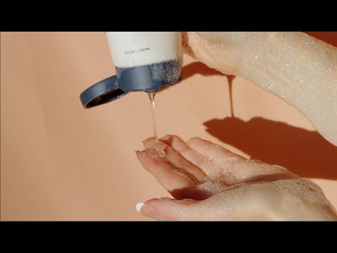Glowbiotics Probiotic Revitalizing Cleanser being poured into hand