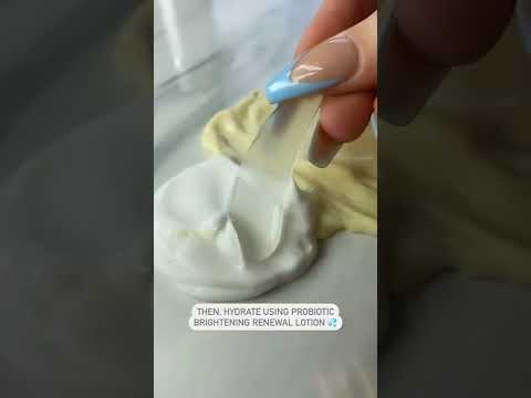 Video still showing product being dispensed from the Probiotic Brightening Renewal Lotion bottle