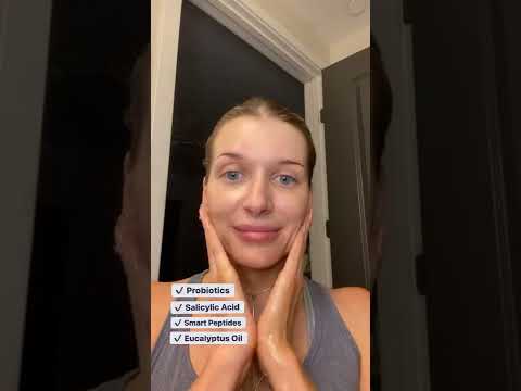 Video thumbnail – woman in bathroom mirror demonstrating Glowbiotics Probiotic Clarifying Cleanser.